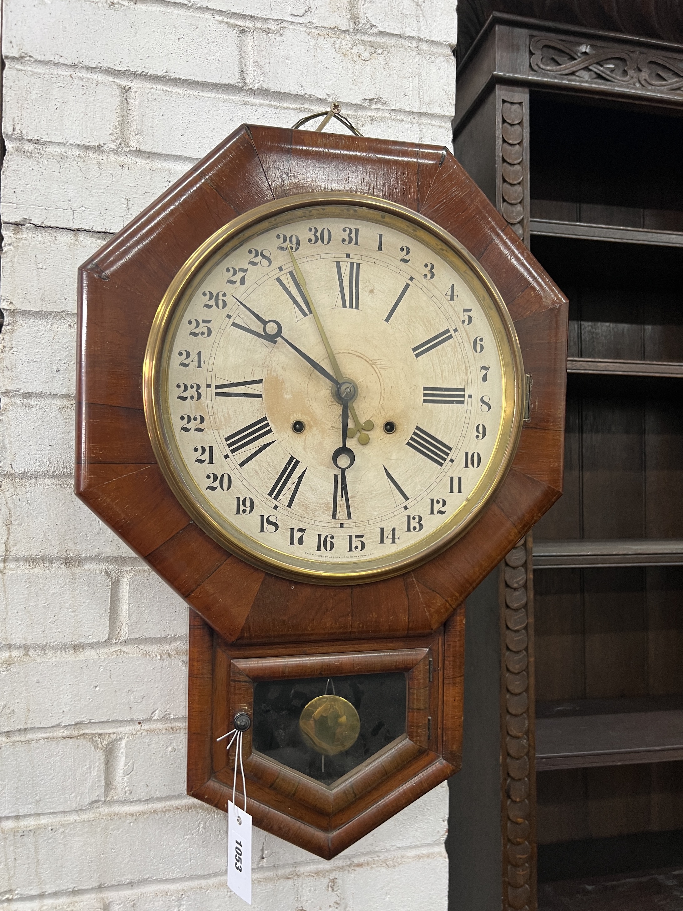 A late 19th century American rosewood drop dial wall timepiece with Arabic calendar dial, height 62cm